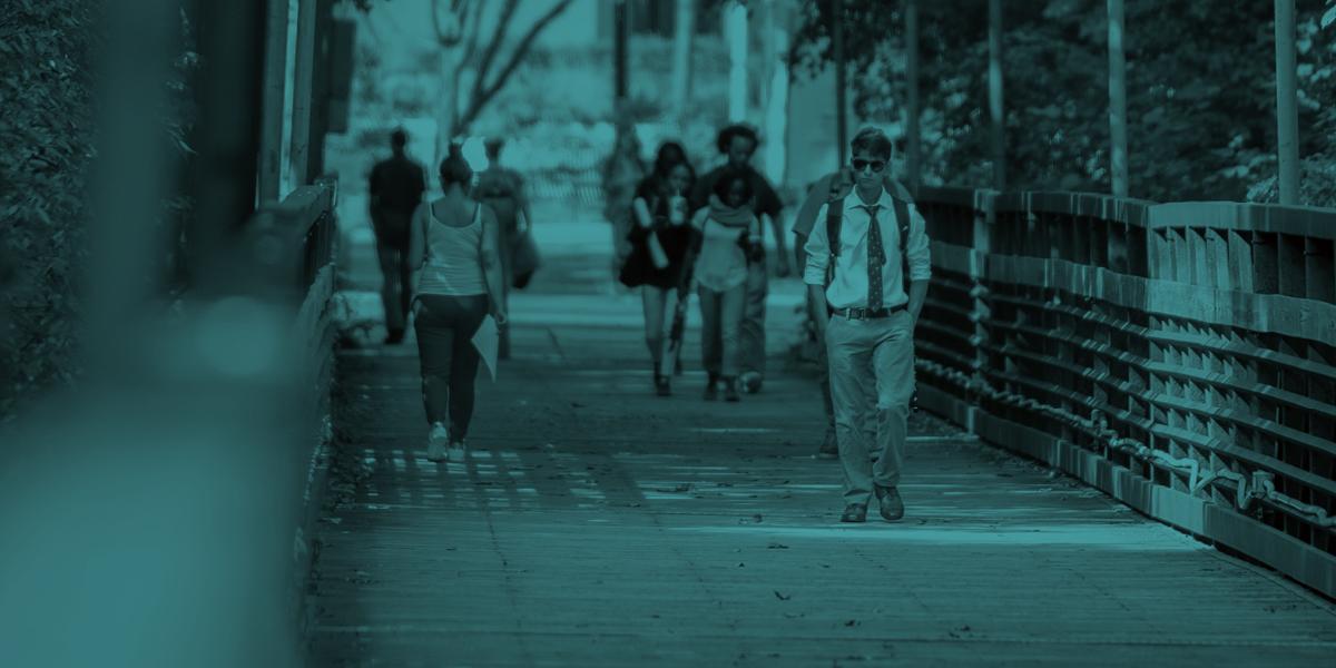 Students walking across the AACC campus.