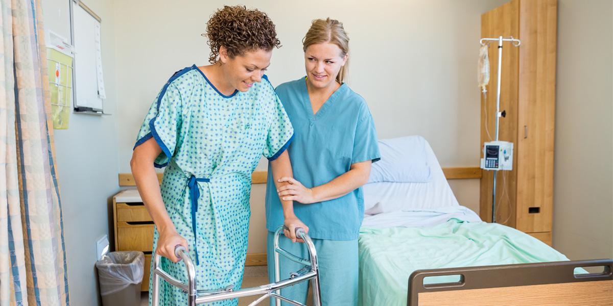 Nurse assistant helping patient